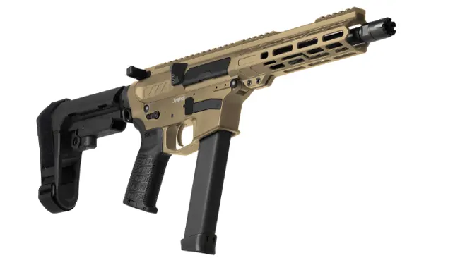 A tan and black pistol caliber carbine with a collapsible stock and extended magazine isolated against a white background.