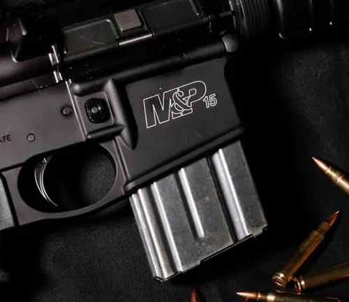 Close-up of a Smith & Wesson M&P 15 rifle's magazine well with magazine inserted and bullets nearby