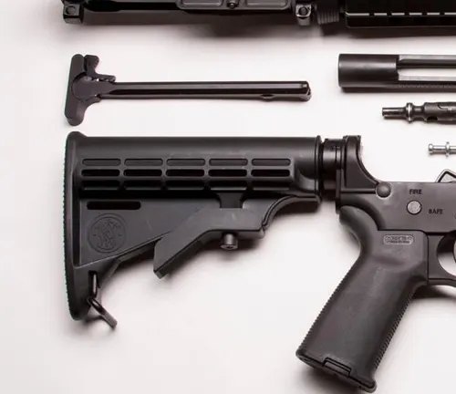 Disassembled parts of a Smith & Wesson M&P 15 rifle, showing the stock and lower receiver