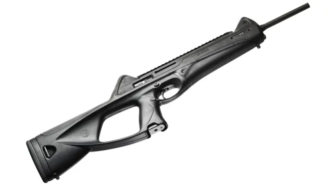 A black bolt-action rifle with an integrated scope rail and an ergonomic stock design.