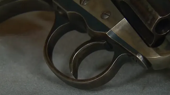 Close-up of the trigger and guard of a Colt 1877 Thunderer revolver.