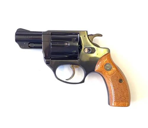 A black Astra 680 revolver with brown wooden grip.
