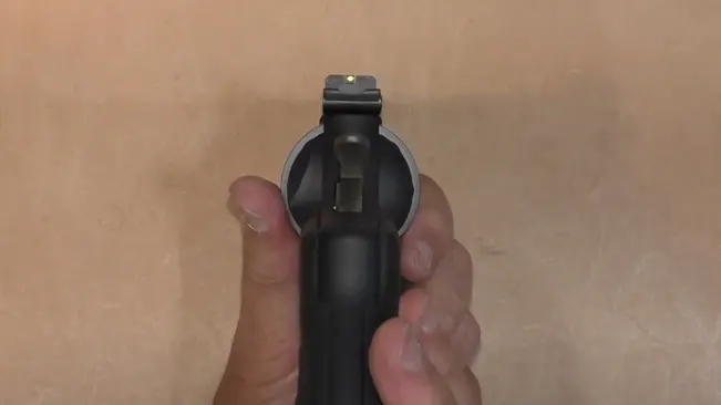 Top view of a TRR8 revolver held in a hand against a neutral background.