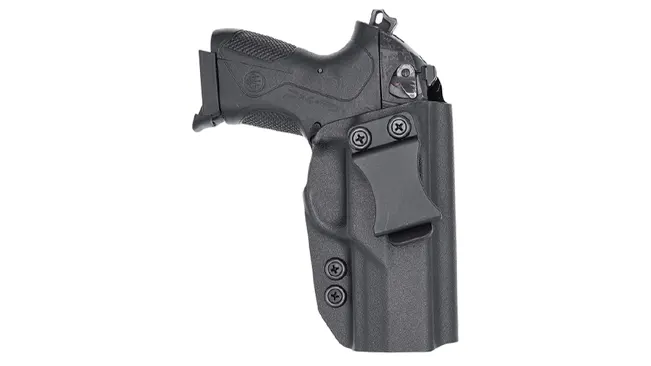 A Beretta PX4 Storm subcompact pistol holstered in a black Kydex inside-the-waistband holster.