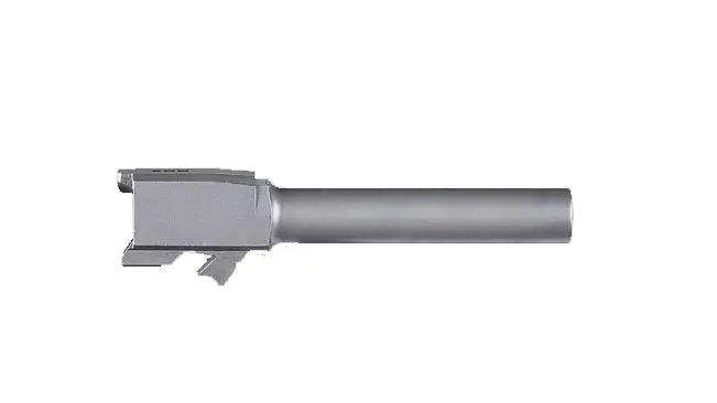 Barrel of an FN FNX-9 pistol isolated on a white background, showing the chamber and part of the barrel extension.