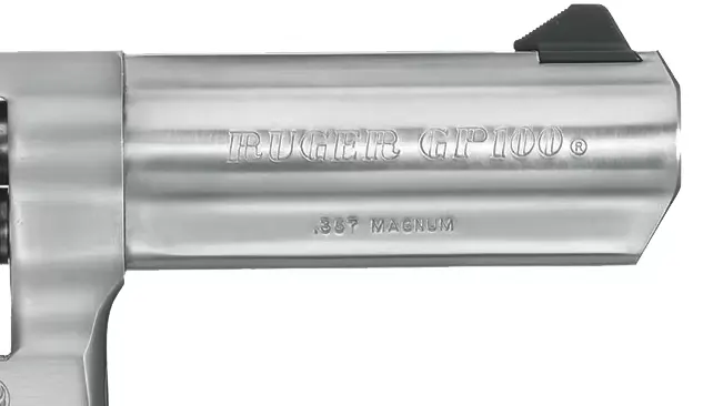 Close-up of the barrel of a Ruger GP100 revolver, with ".357 Magnum" caliber designation engraved.