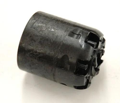 Cylinder of an Uberti 1851 Navy revolver, showing the cap and ball chambers, isolated on a white background.