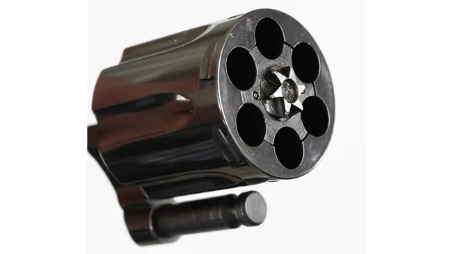 Front view of a Colt Detective Special revolver's cylinder showing empty chambers.