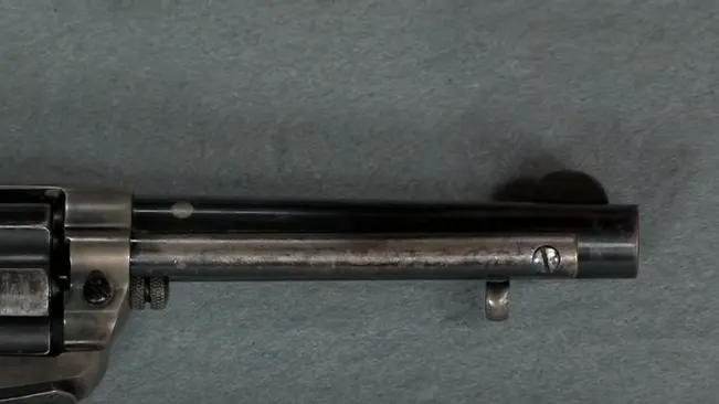 Top view of a Colt 1877 Thunderer revolver's barrel and cylinder.