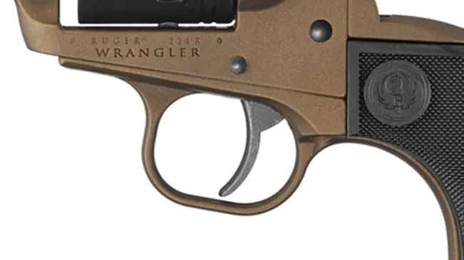 Detail of the trigger and frame marking of a Ruger Wrangler 22LR revolver.