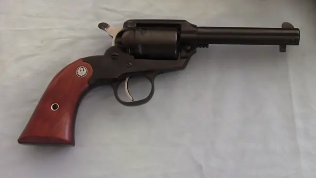 Side view of a Ruger Bearcat .22 revolver with wooden grips.