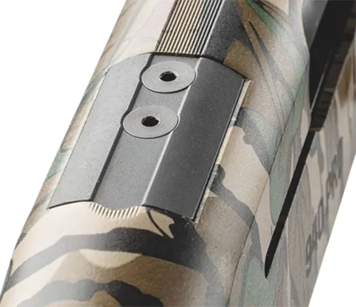 Close-up of the vent rib and sight on a camouflaged Mossberg 940 Pro Turkey shotgun
