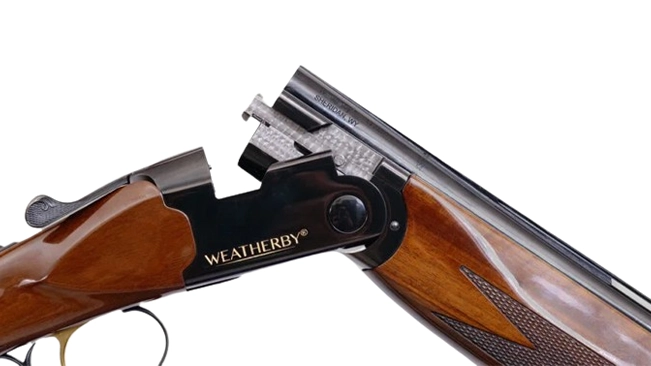 A close-up of a weatherby shotgun with the action open, against a white background.