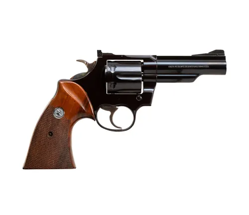 Colt Trooper MK III revolver with a blued finish and wooden grips against a white background.