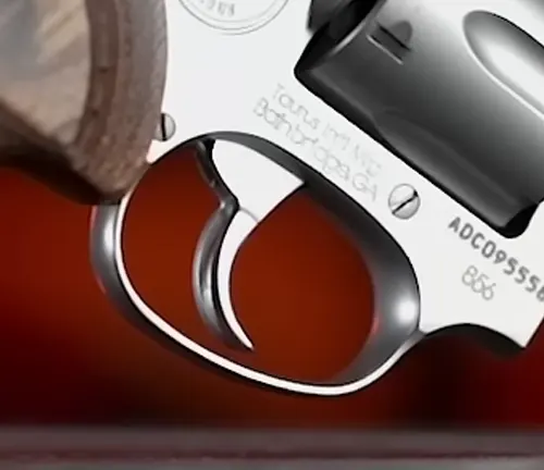 Detailed view of the trigger and trigger guard of a Taurus 856 Executive Grade revolver.