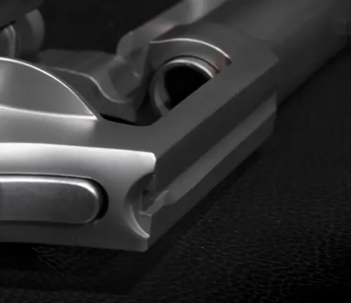 Close-up of the front end of the barrel and cylinder of a Taurus 856 Executive Grade revolver.