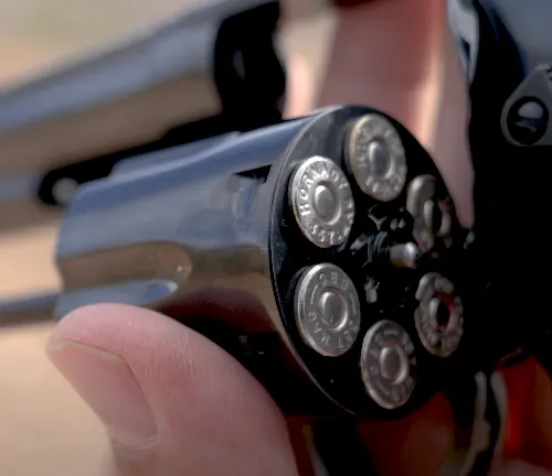 Close-up of a loaded cylinder of a Smith & Wesson Model 586 revolver, with bullets in the chambers.