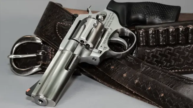Rock Island Armory AL22M revolver on a textured belt with a metal buckle.